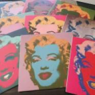 A collection issued by "After Warhol", of 9 wooden portraits in a box.